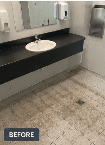 Before — commercial bathroom floor before Assured Cleaning